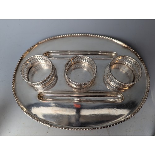 183 - Silver plated desk stand with three various glass pots