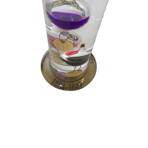 265 - Svaja glass paperweight (signed to base) and a Galileo thermometer ht. 43.5cm