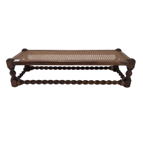 463 - Cane topped stool, with barley twist stretchers. W92cm D33cm H23cm