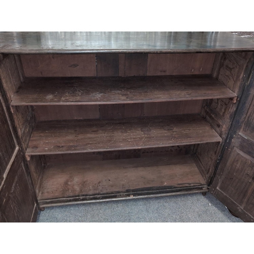 476 - Oak carved cupboard with internal shelves 131cm by 41cm by 109cm