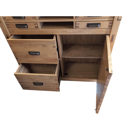 478 - Halo Montana office chest, in nibbed oak. Comprised of 4 upper small drawers, over lower cupboard &a... 