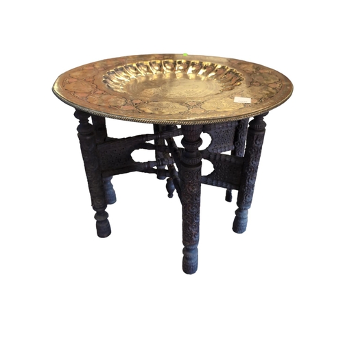 482 - Brass topped benares table. D62cm H50cm