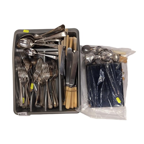 484 - Tray and a bag of assorted flatware inc. bone handled knives