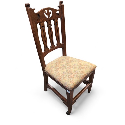 486 - Dining chair with two front casters and tapestry seat, seat height 46cm