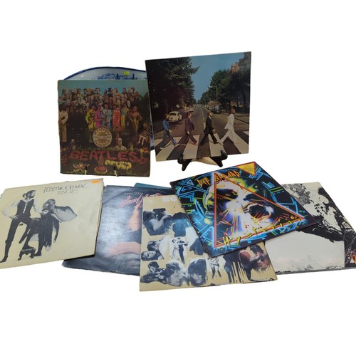 22 - 9 LPs inc. Beatles, Led Zeppelin, Def Leppard, Bowie.