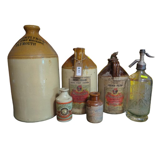 43 - 5 stoneware bottles. Largest reads: J.R. Wilson, Plymouth. Some with paper labels inc. G Widger &... 