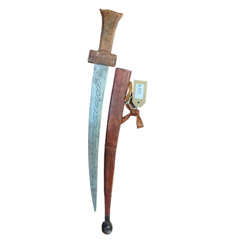 105 - North African Tuareg Takouba sword with leather scabbard, overall length 54.5cm