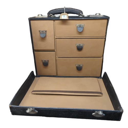 47 - Small travel case with 5 drawer compartments and document pouch. Lockable but without key. Initialle... 