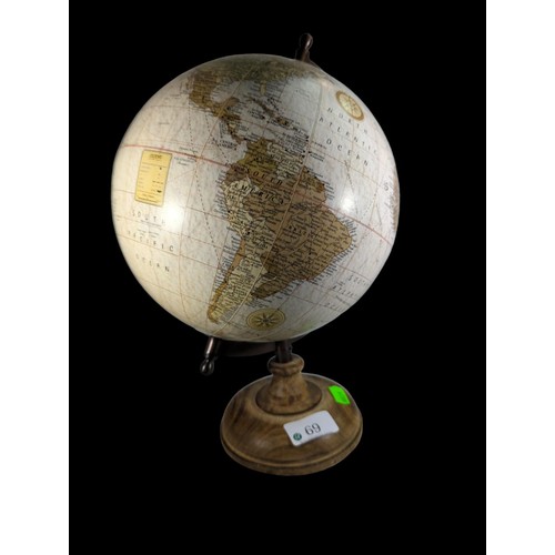 69 - Small globe on turned wooden base. H32cm.