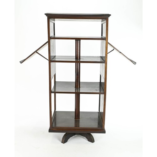 469 - Revolving mahogany bookcase with multiple shelves, incorporating two sheet music holding attach... 