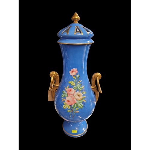 45 - Large lidded vase with figural scene to front and flowers to back. Gilt handles and highlights. H55c... 