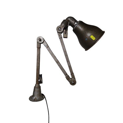 48 - Adjustable, wall-mounted work lamp. 