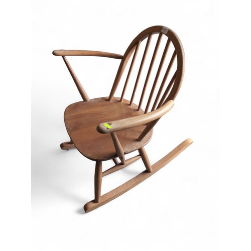 510 - Ercol Windsor Tub-rocking chair, model 470. Natural finish. Includes popping seat cushion.