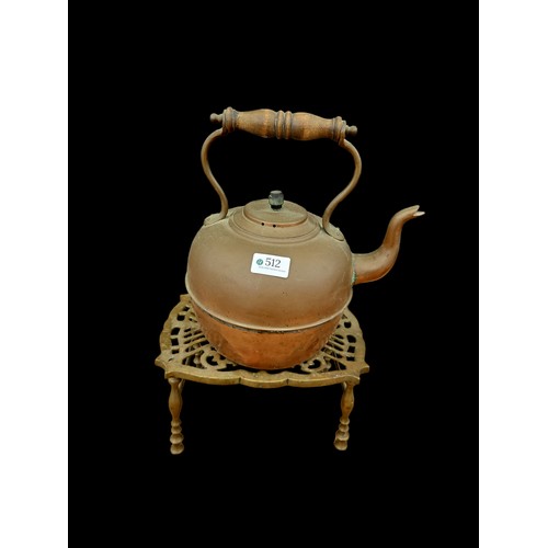 512 - Copper kettle and brass trivet.