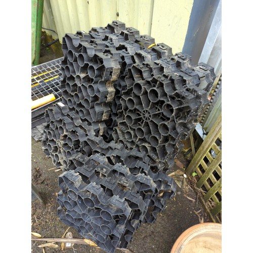 11 - 33 sections of plastic grid system flooring. each 33cmx33cmx4cm.