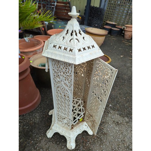 137 - Victorian style hexagonal cast iron heater with coloured glass panels,  ht 88cms