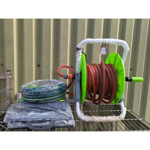 18 - Hose reel and hose + brand new 15m starter hose pack + 2 packs of weed control fabric (8mx1.5m).&nbs... 