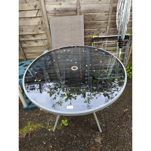 45 - Glass-topped, metal-framed, circular, fold-up garden table + 4 metal chairs. Diameter of table - 88c... 