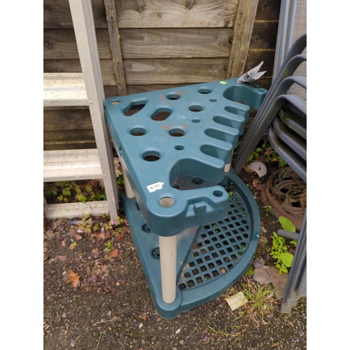 46 - Plastic corner unit, garden tool rack. W76cm.