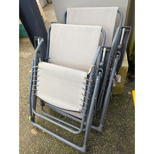 52 - 2 fold-up garden recliners.