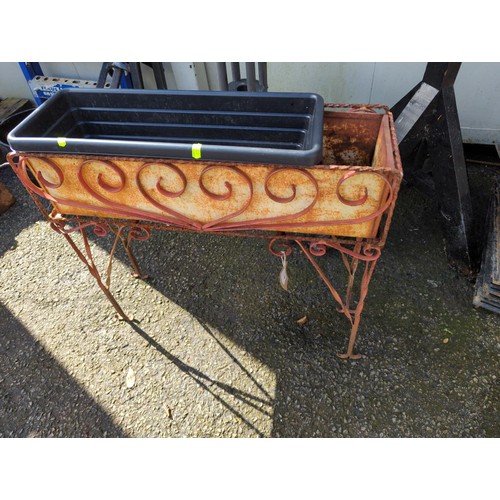 67 - Wrought iron, raised planter. L62cm, H59cm, W20cm.