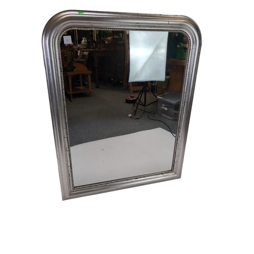 814 - Silver coloured frame over mantle mirror. W86cm H110cm