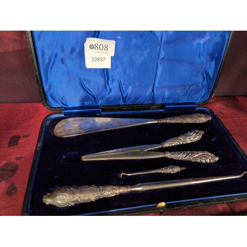 808 - Cased silver handled shoe horn, button hook and glove stretcher set, makers Levi & Salaman, Birm... 