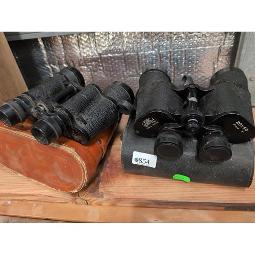 854 - 2 pairs of cased binoculars inc. Mark Scheffel 20x50 and Greenkat 7x50.