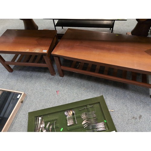 875 - Two teak coffee tables with lower slated shelves, 107x46x39cm and 65.5x40x39cm respectively