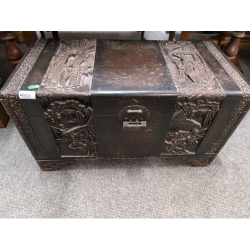 880 - Eastern, carved camphor chest. L67cm, D32cm, H37cm.