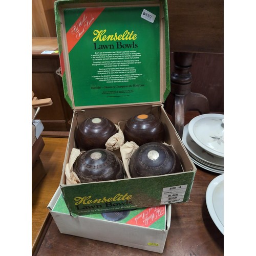 889 - 2 sets of 4 Henselite lignum vitae lawn bowls in original boxes.