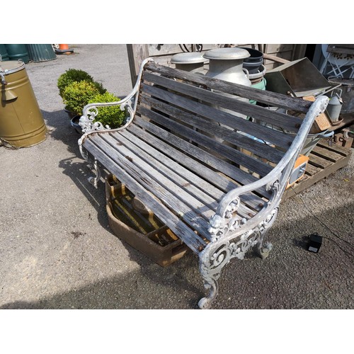 83 - Cast metal garden bench. W126cm, H82cm, D62cm.