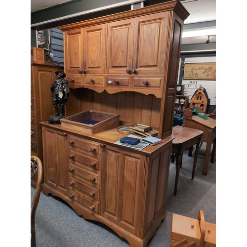 926 - Elm and oak dresser, comprising nine drawers and four cupboards, width 144cm, depth 63cm, height 205... 