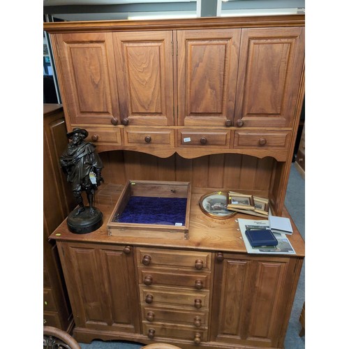 926 - Elm and oak dresser, comprising nine drawers and four cupboards, width 144cm, depth 63cm, height 205... 