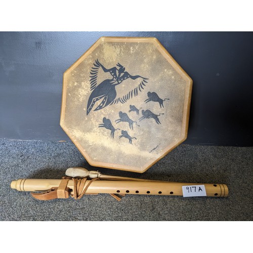 917A - Native American flute (signed) together with a skin war drum with beater, dia. 43cm