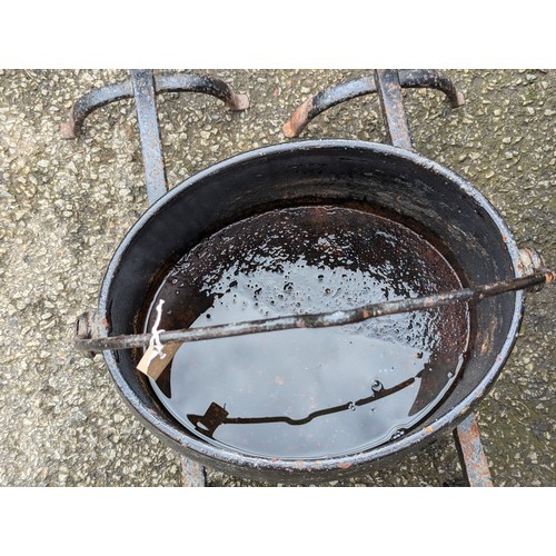 70 - Large, cast iron cooking pot/cauldron + 2 fire dogs. 