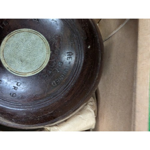 889 - 2 sets of 4 Henselite lignum vitae lawn bowls in original boxes.