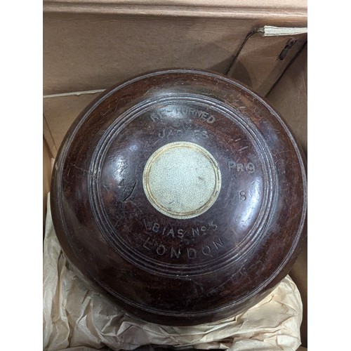 889 - 2 sets of 4 Henselite lignum vitae lawn bowls in original boxes.