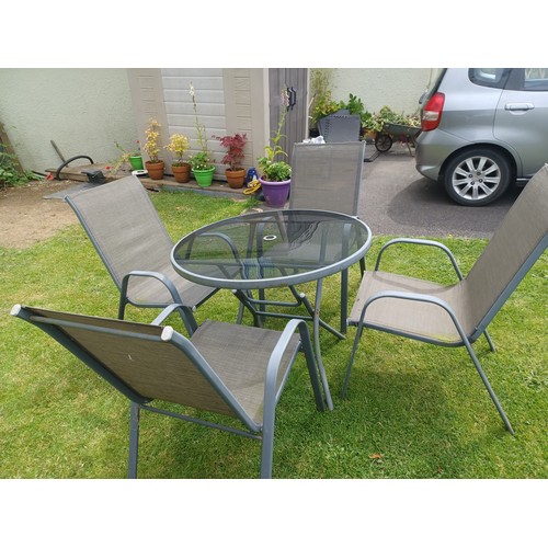 45 - Glass-topped, metal-framed, circular, fold-up garden table + 4 metal chairs. Diameter of table - 88c... 