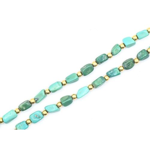 13 - Freeform turquoise and yellow metal bead necklace with an 18ct gold clasp, length 520mm, gross weigh... 