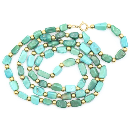 13 - Freeform turquoise and yellow metal bead necklace with an 18ct gold clasp, length 520mm, gross weigh... 