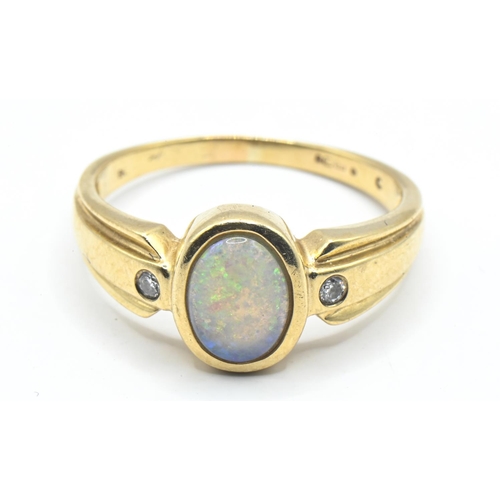 15 - 9ct gold ring set with opal with two small diamonds at the shoulders, size R, gross weight 3.53 gram... 