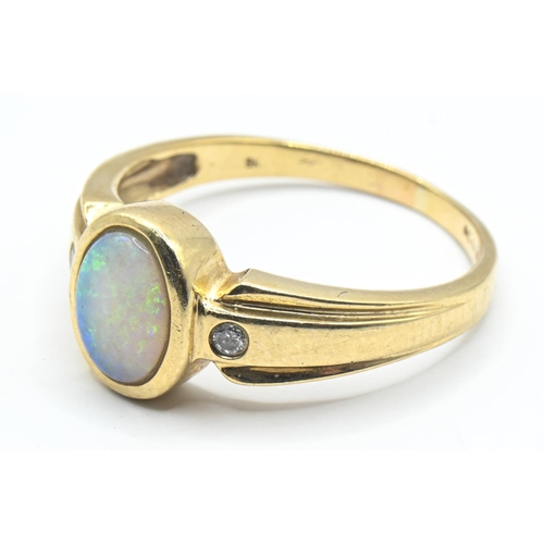 15 - 9ct gold ring set with opal with two small diamonds at the shoulders, size R, gross weight 3.53 gram... 