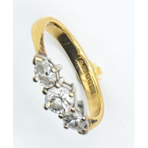 17 - 18ct gold and three stone diamond ring, centring a round brilliant-cut diamond weighing approximatel... 