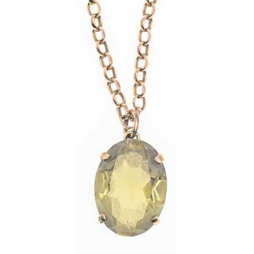 21 - Oval mixed cut citrine pendant mounted in 9ct gold on a 9ct gold chain, chain length 600mm, citrine ... 