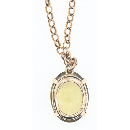 21 - Oval mixed cut citrine pendant mounted in 9ct gold on a 9ct gold chain, chain length 600mm, citrine ... 