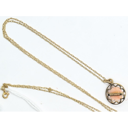 26 - Carved coral and 9ct open work gold pendant on a fine 9ct gold twist chain, length 500mm, gross weig... 