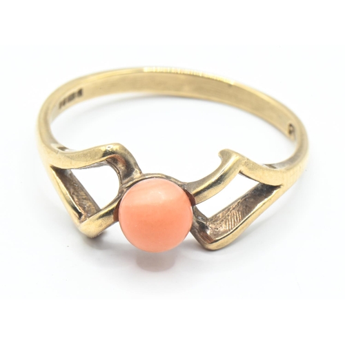 27 - 9ct gold ring set with coral in an open work twist, size P, gross weight 2.04 grams