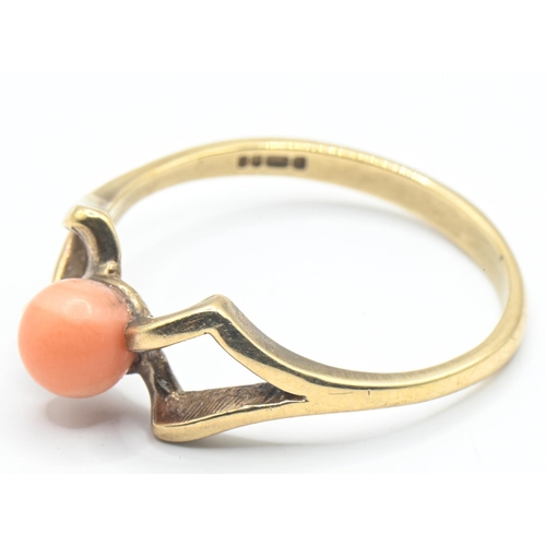 27 - 9ct gold ring set with coral in an open work twist, size P, gross weight 2.04 grams