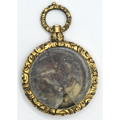 31 - Victorian yellow metal, black enamel and hairwork mourning pendant, the obverse with enamel band ann... 